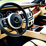 **

"The interior of a Rolls-Royce Ghost, showcasing bespoke craftsmanship with cream-colored leather and olive wood trim, fully clothed, safe for work, appropriate content, perfect anatomy, correct proportions, natural lighting, a professional photograph, showing attention to detail, emphasizing luxury and comfort, family-friendly, high resolution"

**